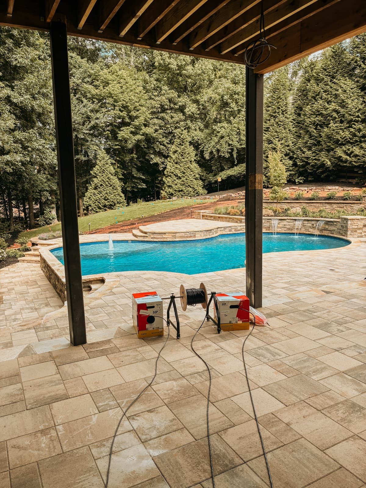 Outdoor speaker prewire for a patio sitting area and pool