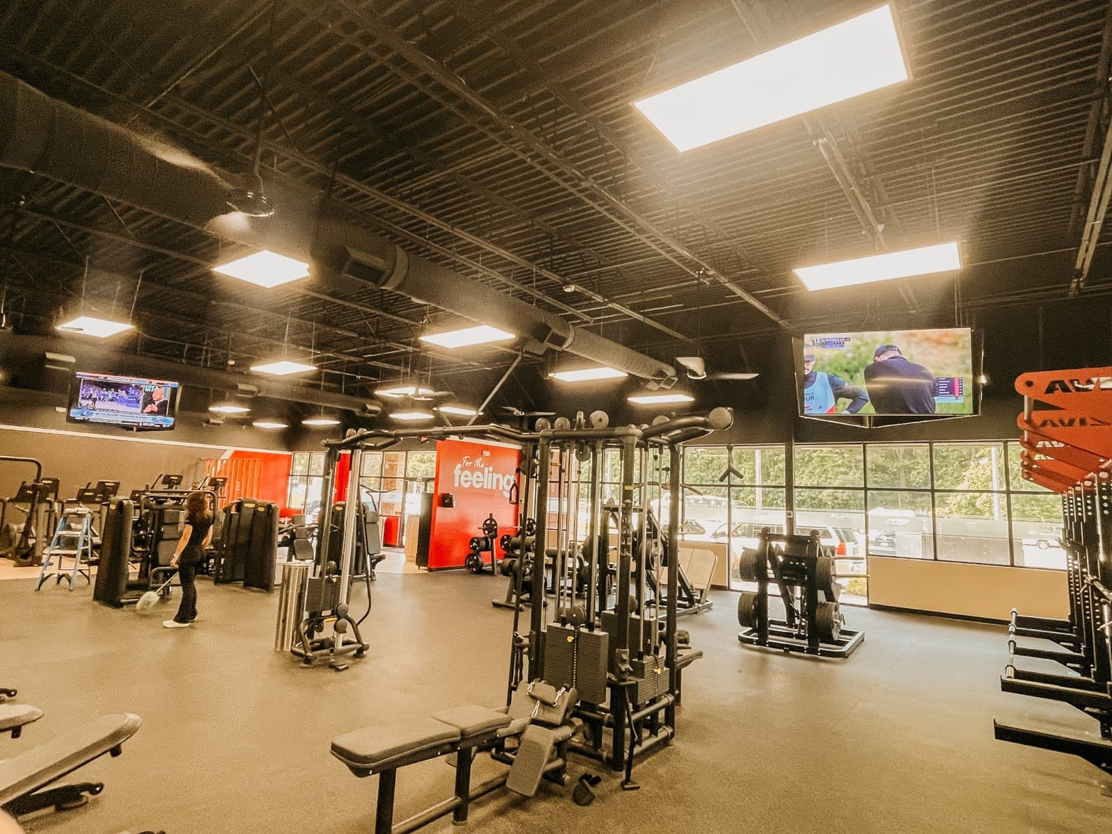 Snap Fitness gym with mounted TVs, speakers, network, and cameras