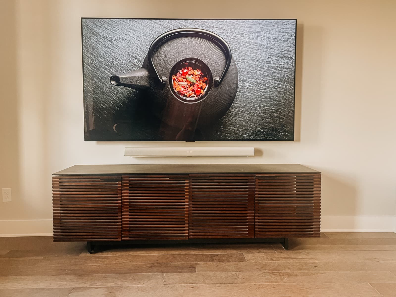 Wall-mounted OLED TV with Sonos soundbar